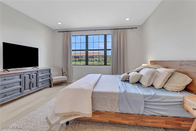 bedroom featuring recessed lighting and wood finished floors