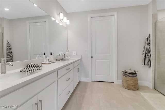 bathroom featuring tile patterned flooring, a sink, double vanity, and tiled shower