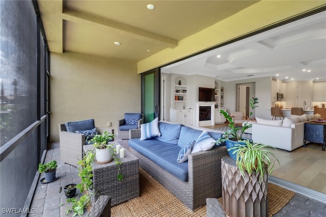 exterior space featuring an outdoor living space and a patio area
