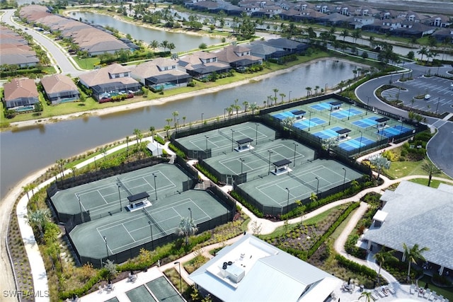 birds eye view of property with a residential view and a water view