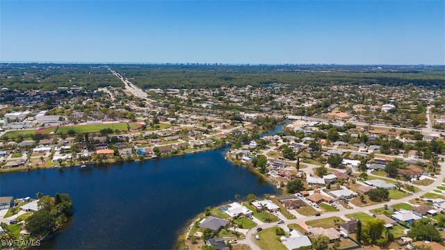 birds eye view of property with a residential view and a water view