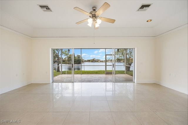 unfurnished room with a water view, visible vents, baseboards, and light tile patterned floors