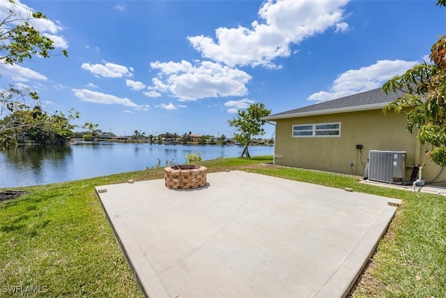 5036 29th Pl SW, Naples, FL 34116 - view of patio with central air condition unit, an outdoor fire pit, and a water view