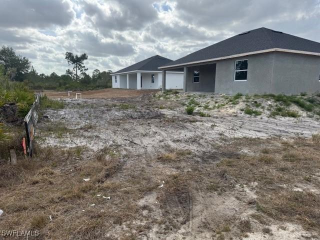 2918 29th St W, Lehigh Acres, FL 33971 - view of home's exterior featuring stucco siding