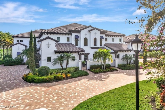 exterior space featuring stucco siding and a tile roof