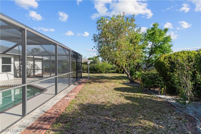 view of yard featuring a patio, glass enclosure, and an outdoor pool