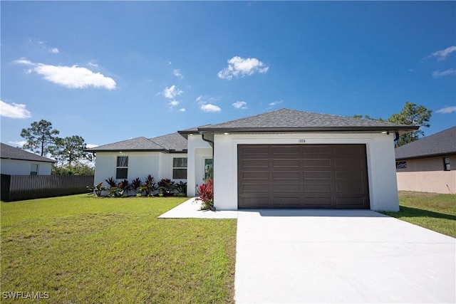 prairie-style house featuring driveway, an attached garage, and stucco siding