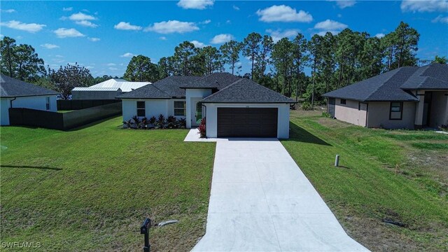 view of front of property featuring a garage, driveway, and stucco siding