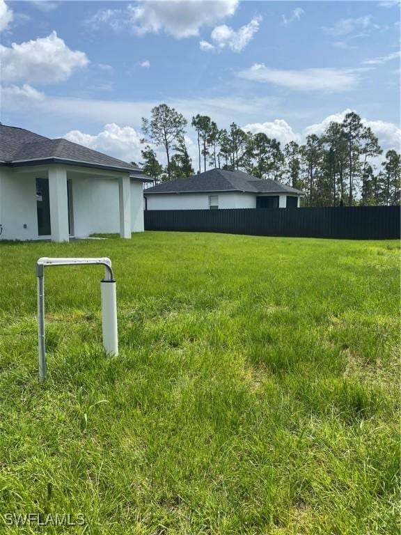 view of yard with fence