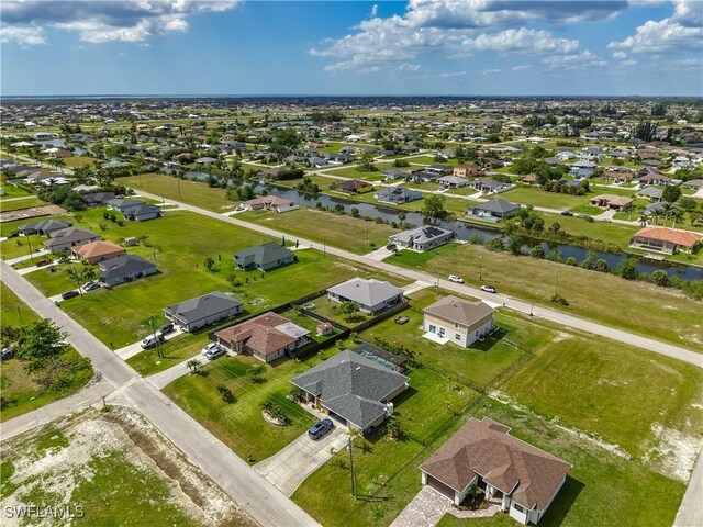 2732 NW 3rd Ter, Cape Coral, FL 33993 - drone / aerial view with a water view and a residential view