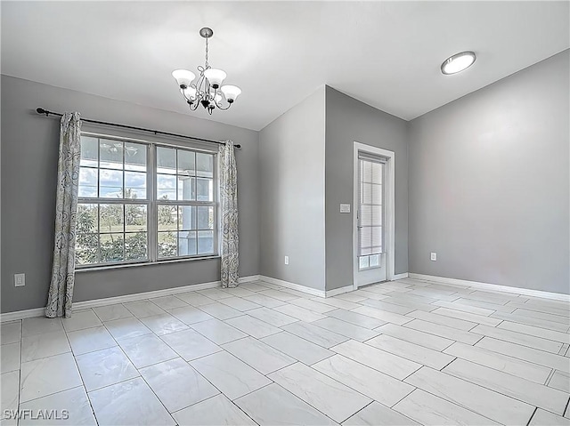 2732 NW 3rd Ter, Cape Coral, FL 33993 - unfurnished dining area with an inviting chandelier and baseboards