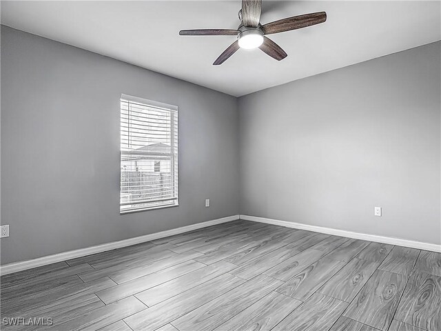 2732 NW 3rd Ter, Cape Coral, FL 33993 - unfurnished room featuring wood finished floors, ceiling fan, and baseboards