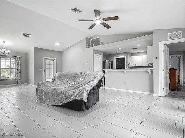 2732 NW 3rd Ter, Cape Coral, FL 33993 - living area with visible vents, vaulted ceiling, and ceiling fan with notable chandelier