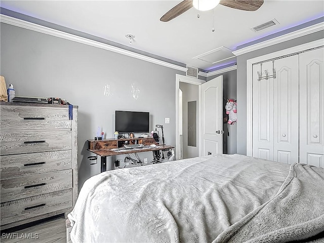 2732 NW 3rd Ter, Cape Coral, FL 33993 - bedroom with a closet, wood finished floors, ornamental molding, and visible vents