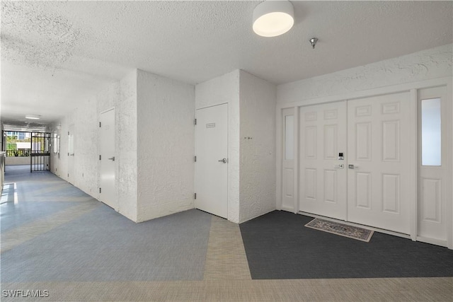 4031 Gulf Shore Blvd N Unit 3E, Naples, FL 34103 - foyer entrance with a textured ceiling and a textured wall