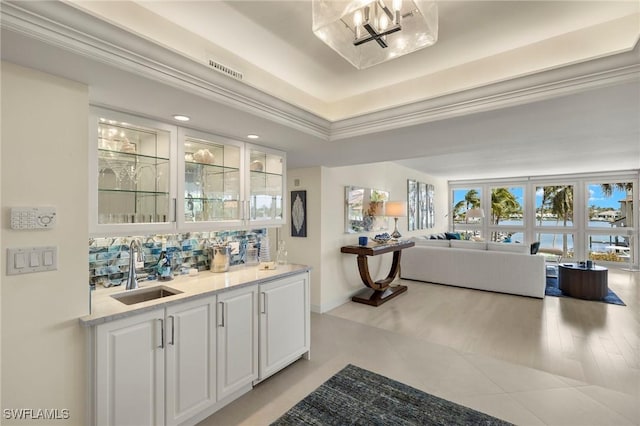 4031 Gulf Shore Blvd N Unit 3E, Naples, FL 34103 - bar featuring wet bar, recessed lighting, visible vents, a tray ceiling, and a sink