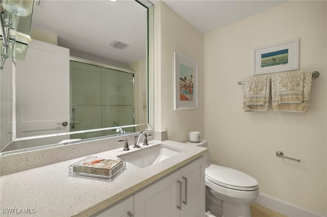 4031 Gulf Shore Blvd N Unit 3E, Naples, FL 34103 - bathroom with visible vents, baseboards, toilet, a shower stall, and vanity