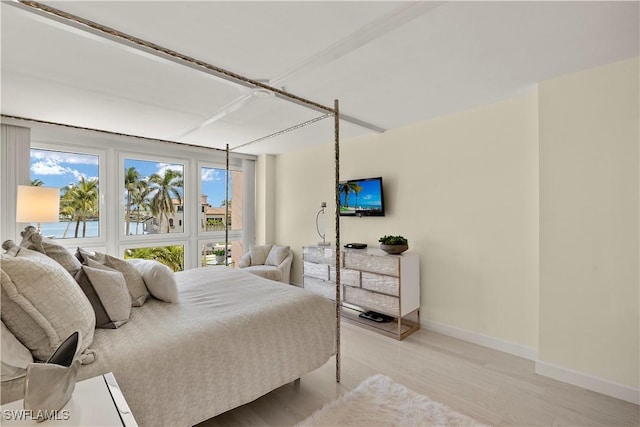 4031 Gulf Shore Blvd N Unit 3E, Naples, FL 34103 - bedroom featuring baseboards and light wood-style floors