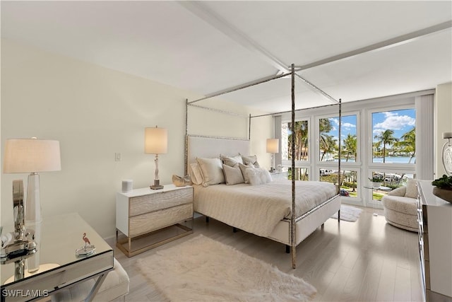 4031 Gulf Shore Blvd N Unit 3E, Naples, FL 34103 - bedroom featuring light wood-style flooring