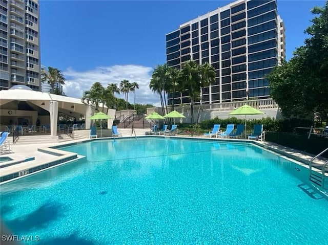 4031 Gulf Shore Blvd N Unit 3E, Naples, FL 34103 - community pool featuring a patio area and fence