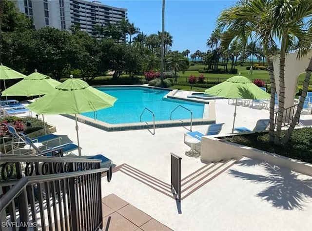 4031 Gulf Shore Blvd N Unit 3E, Naples, FL 34103 - community pool featuring a patio