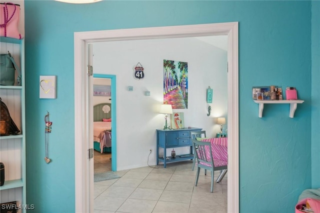 bedroom with light tile patterned floors