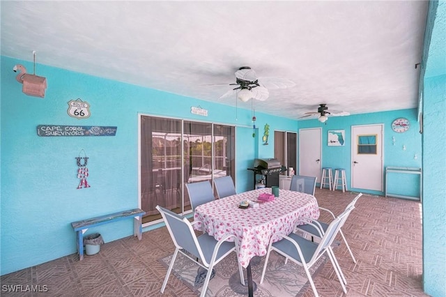 view of patio / terrace with outdoor dining space, grilling area, and ceiling fan