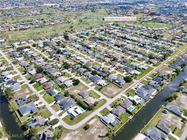 birds eye view of property with a residential view and a water view