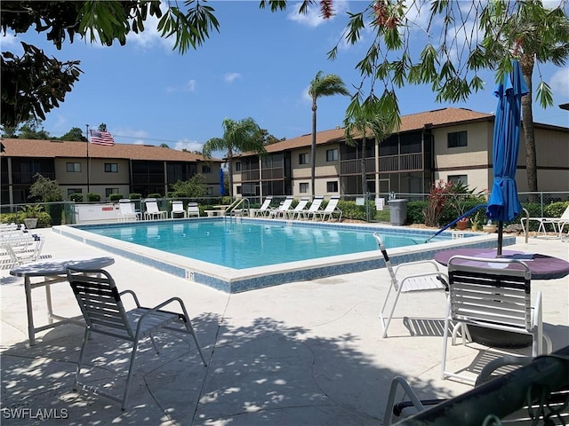 community pool featuring a patio area