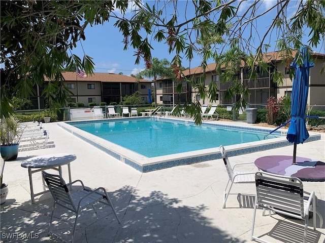 community pool featuring a patio area