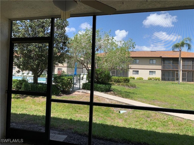 exterior space featuring ceiling fan
