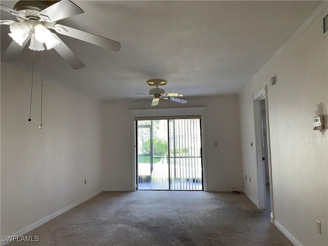 unfurnished room with visible vents, ceiling fan, baseboards, and carpet