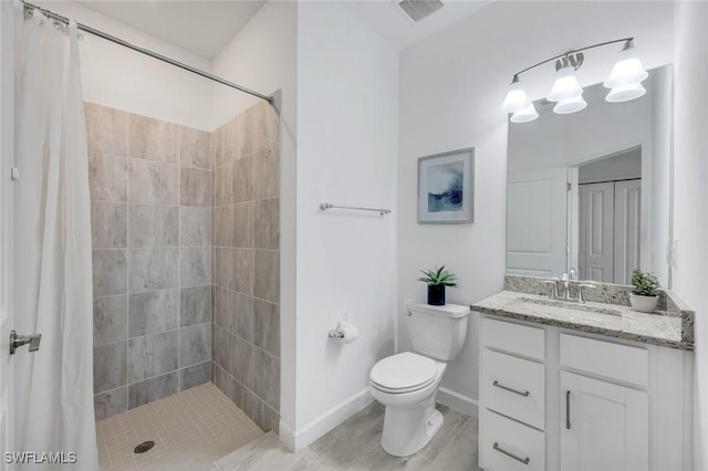11477 Canopy Loop, Fort Myers, FL 33913 - full bathroom featuring toilet, vanity, a tile shower, baseboards, and tile patterned flooring
