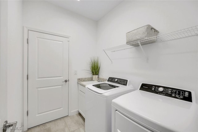 11477 Canopy Loop, Fort Myers, FL 33913 - laundry room featuring washer and clothes dryer and cabinet space
