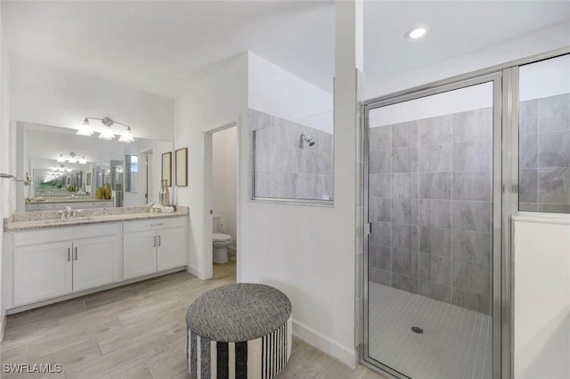 11477 Canopy Loop, Fort Myers, FL 33913 - full bathroom with a shower stall, vanity, toilet, and baseboards