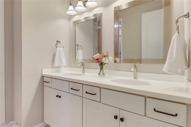 7175 Wilton Dr, Naples, FL 34109 - bathroom with double vanity and a sink