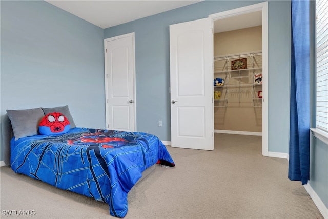 7175 Wilton Dr, Naples, FL 34109 - bedroom featuring carpet floors, baseboards, and a walk in closet