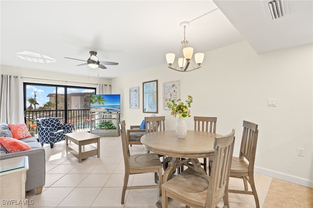 671 E Gulf Dr Unit 2C2, Sanibel, FL 33957 - dining room featuring ceiling fan with notable chandelier, light tile patterned flooring, baseboards, and visible vents