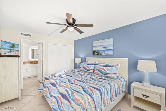 671 E Gulf Dr Unit 2C2, Sanibel, FL 33957 - bedroom featuring a closet, connected bathroom, light tile patterned flooring, visible vents, and ceiling fan