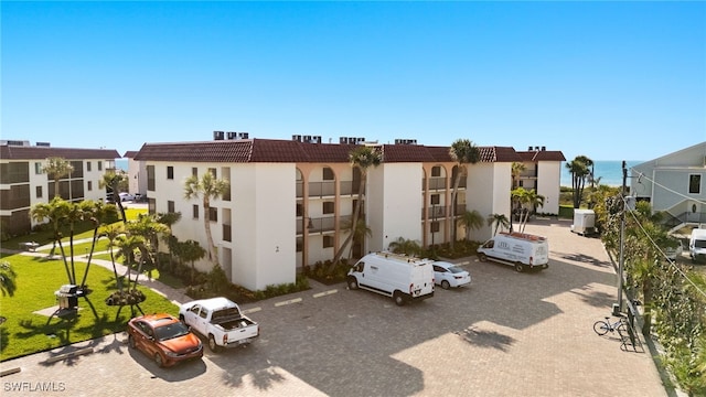 671 E Gulf Dr Unit 2C2, Sanibel, FL 33957 - view of property with uncovered parking