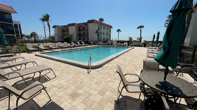 671 E Gulf Dr Unit 2C2, Sanibel, FL 33957 - community pool with fence and a patio