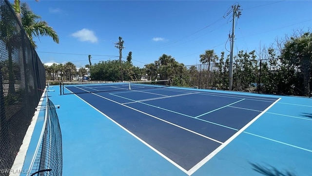 671 E Gulf Dr Unit 2C2, Sanibel, FL 33957 - view of tennis court with fence and community basketball court