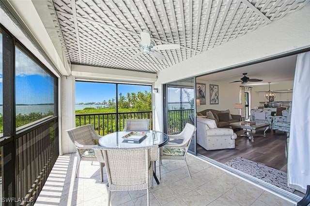 15123 Captiva Dr Unit 104, Captiva, FL 33924 - sunroom / solarium with an outdoor living space, outdoor dining area, and a ceiling fan