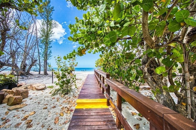 15123 Captiva Dr Unit 104, Captiva, FL 33924 - surrounding community featuring a water view, a beach view, and fence
