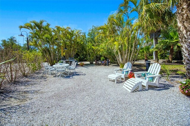 15123 Captiva Dr Unit 104, Captiva, FL 33924 - view of yard featuring a patio