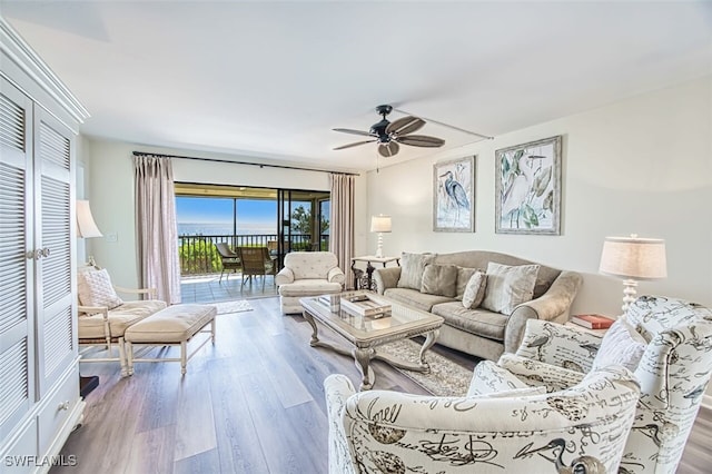 15123 Captiva Dr Unit 104, Captiva, FL 33924 - living area featuring a ceiling fan and wood finished floors