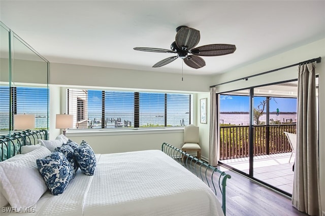 15123 Captiva Dr Unit 104, Captiva, FL 33924 - bedroom with access to exterior, wood finished floors, and ceiling fan