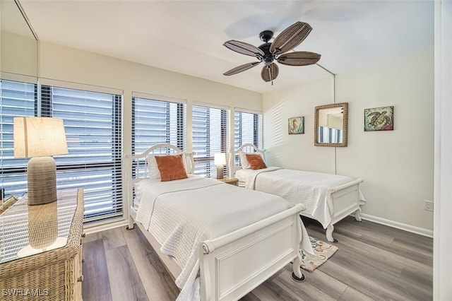 15123 Captiva Dr Unit 104, Captiva, FL 33924 - bedroom featuring wood finished floors, baseboards, and a ceiling fan