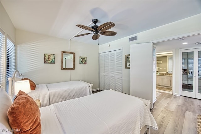 15123 Captiva Dr Unit 104, Captiva, FL 33924 - bedroom with light wood-type flooring, a closet, a ceiling fan, visible vents, and a sink