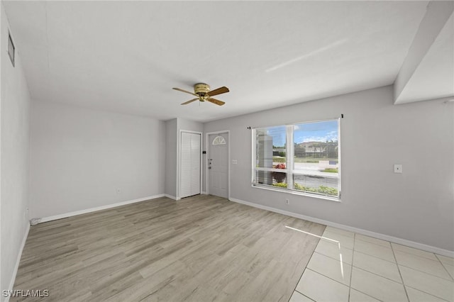 5032 Chiquita Blvd S Unit 101, Cape Coral, FL 33914 - foyer with ceiling fan, baseboards, and wood finished floors